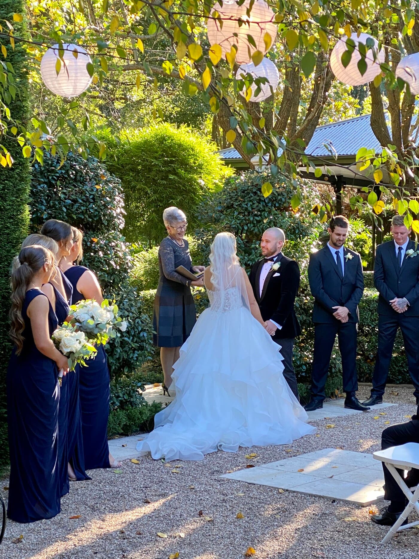 The garden ceremony at Jaspers Berry, paper lanterns strung through the trees